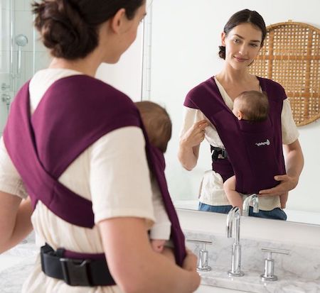 Ergobaby Embrace has X-crossed fabric shoulder straps that look like a wrap