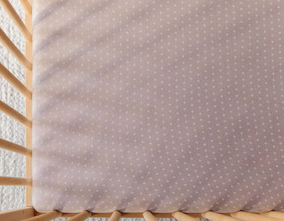 How tight should crib sheet fit