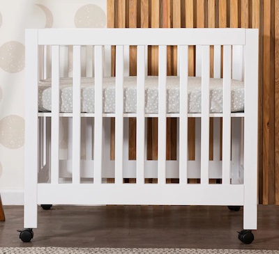 Babyletto Origami Mini Portable Crib with Wheels folds down