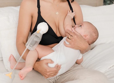 Holding baby when breastfeeding and pumping at the same time while staying in a wrong position can strain your back and make your neck overstretched
